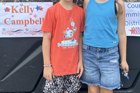 Kage and Ellie Campbell smiling big for the Independence Day Parade. Their dad is Kelly Campbell, Coal County Commissioner District #3.