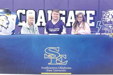 Kolt Hock with his great-grandmother Ruth Williams, left, and grandmother/guardian Tina Hambleton on OSU signing day.