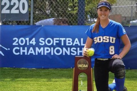 Laramie next to the NCAA District 1 Super Regional Championship trophy.