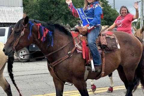 Raylee Winters riding horseback in the 4th of July parade. Raylee is the Ada Area Roundup Club Sweetheart.