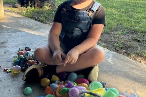 Julia Sandmann looking for a prize egg after the egg hunt.