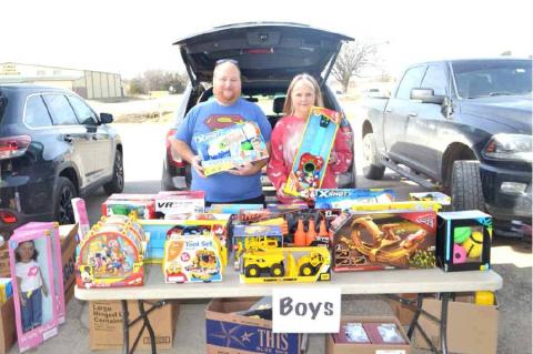PICTURED AT THE BOYS’ GIFT TABLE ARE EVERETT PICKENS AND SHARON PICKENS.